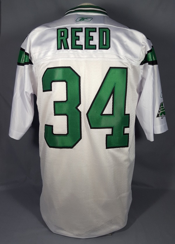 white and green football jersey with REED / 34