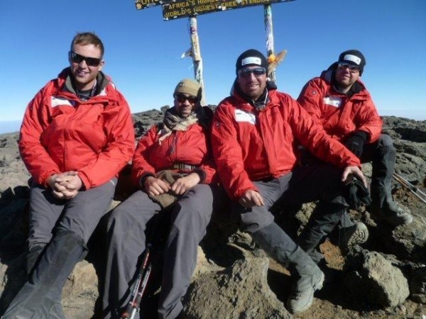 photograph of Mark Fuchko and team on summit of Mount Kilimanjaro