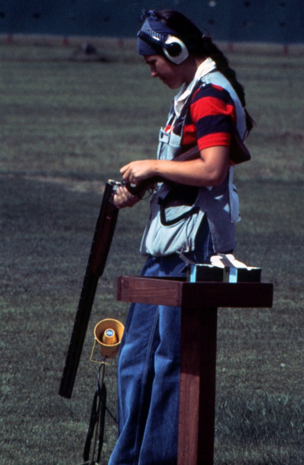 Photograph of Susan Nattrass loading rifle