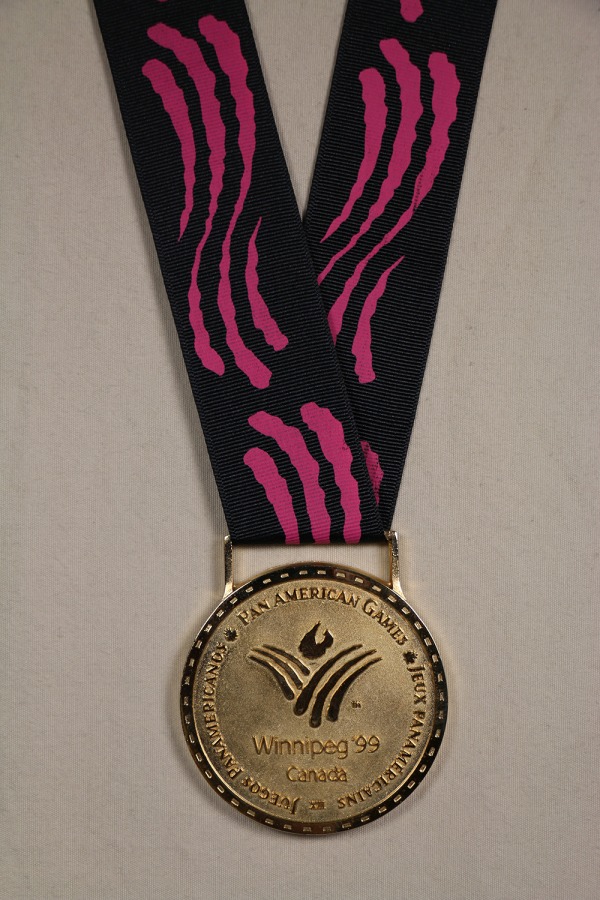 gold medal with W logo on red and black ribbon