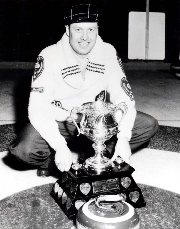 Photograph Matt Baldwin with Brier trophy and curling stone