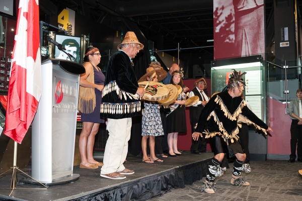 photograph of First Nations drummers, singers and dancer