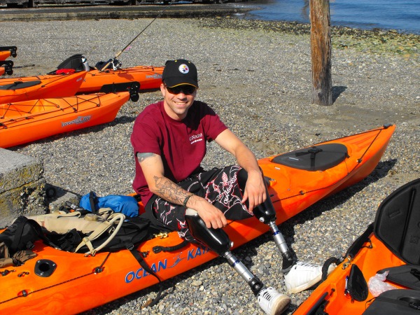 photograph of Mark Fuchko sitting on kayak