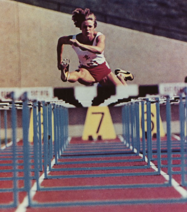 Photograph of Diane Jones Konihowski running over hurdles