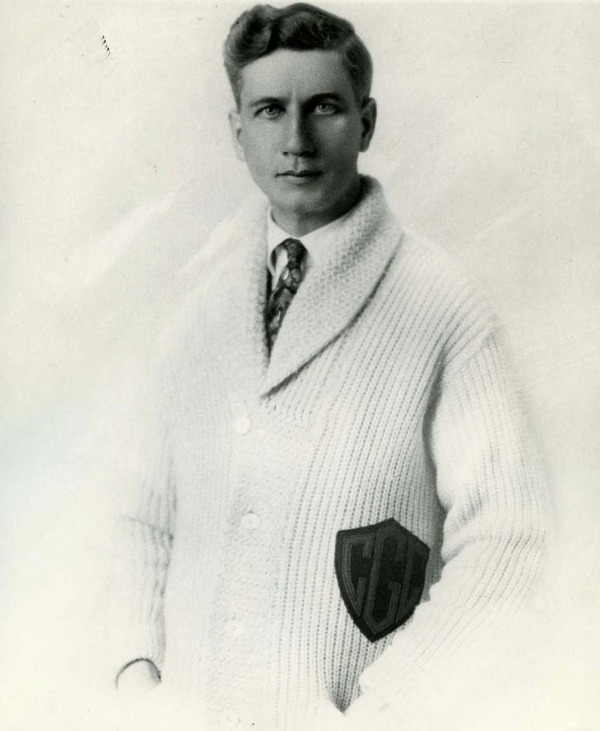 photograph of J. Percy Page wearing white sweater with crest